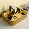Golden and black color luxury ceramic wholesaler bathroom round washbasin with Counter top sink new design art basin