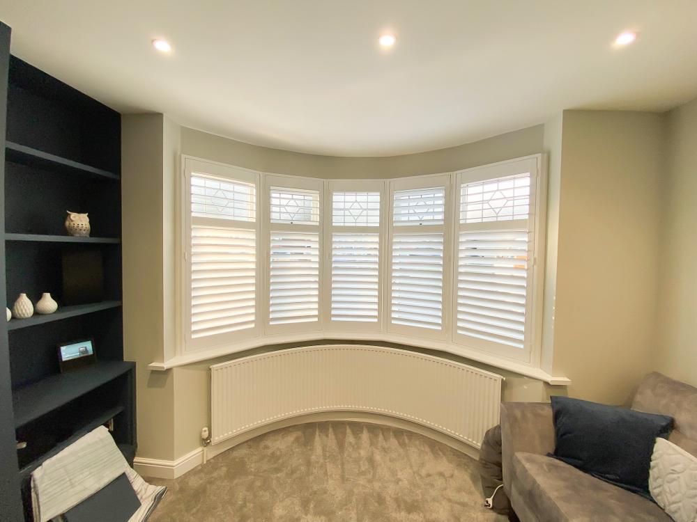 White indoor Bi-fold window basswood shutters