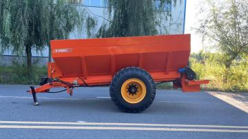 Frozen and dried manure spreader