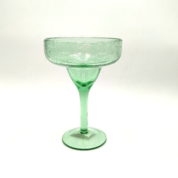 green glass carafe champagne coupe flute with bubble