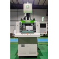 Vertical double sliding injection machine