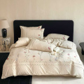 Conjunto de cama bordado floral com design elegante