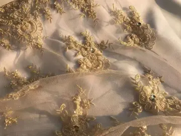 Embroidered fabric with sequins and pearls