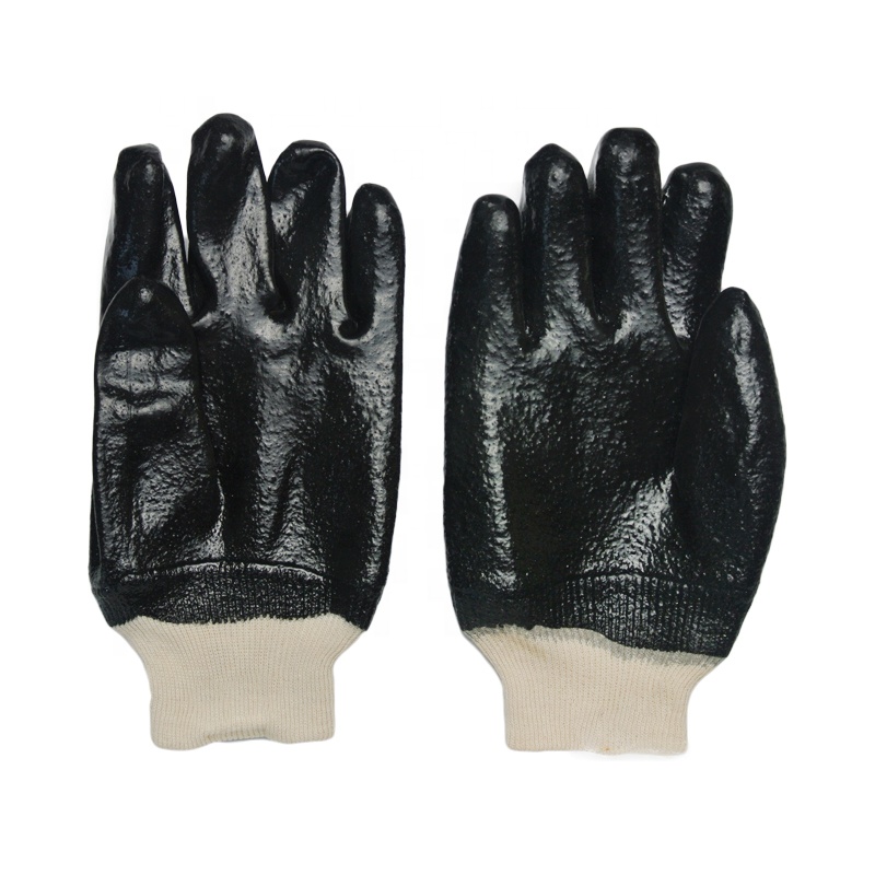 Guantes de PVC negros. acabado rugoso .Tejido de muñeca