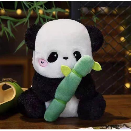 Giant pandas eat bamboo stuffed animals