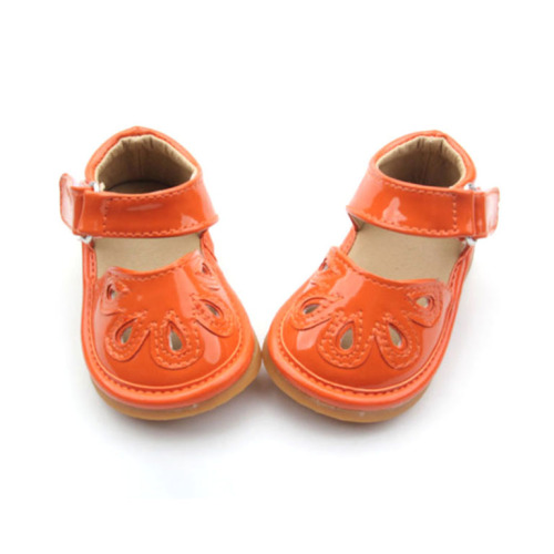 Baby Squeaky Shoes PU Changeable PU Leather Orange Hollow Squeaky Shoes Sandals Supplier