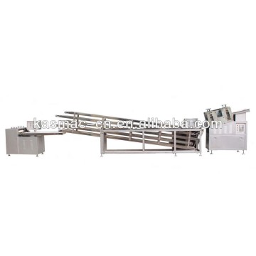 Double rollers flattening and cutting machine for peanut bar and sesame