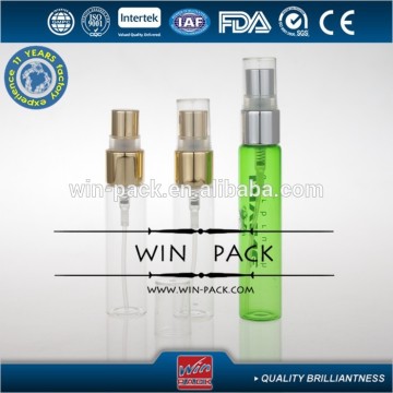 green essential oil bottle with shiny silver aluminum sprayer