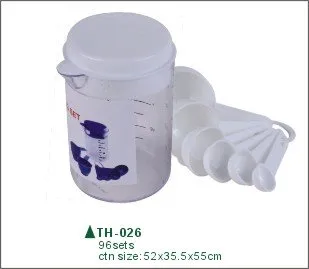 plastic measuring cup with measuring spoons