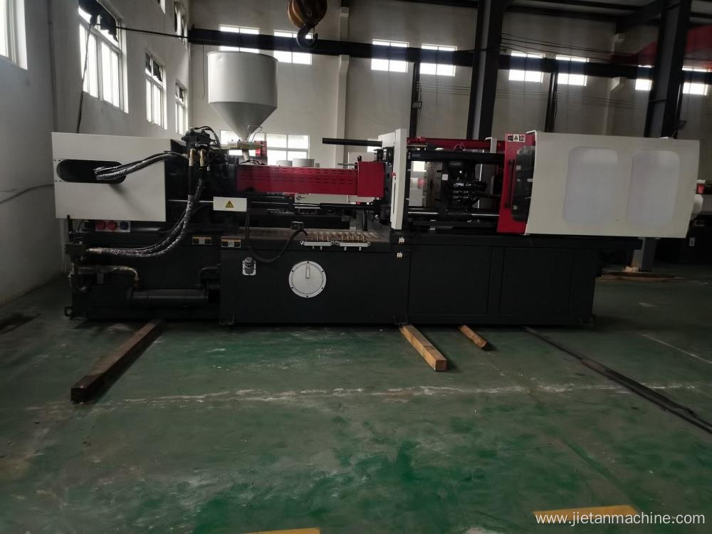 Injection molding machine with robot arm