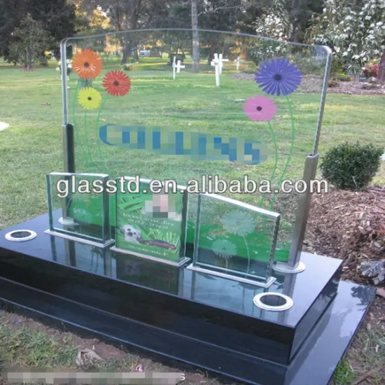 european style glass cremation headstone with trees