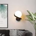 Spiral metal arm wall lamp opal glass shade