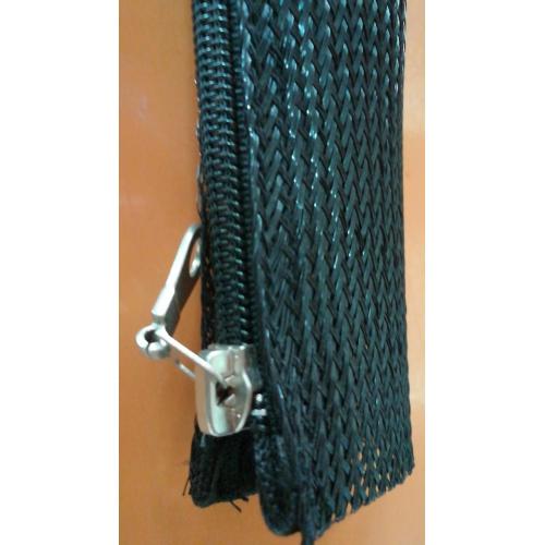Black Zipper Sleeving Around Wire Hose