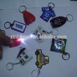 2015 rould shape with led light pass en71 pvc led key chian