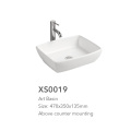 White color bothroom ceramic basin with mixer tap