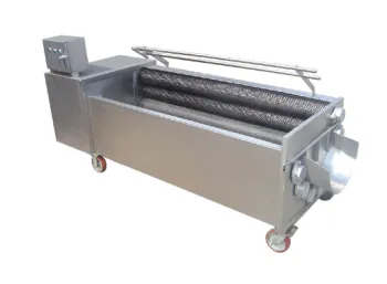 Attrition type vegetable peeler