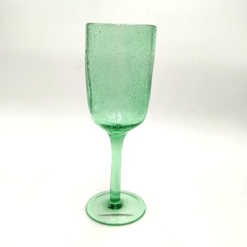 caraffa di vetro verde champagne coupé flute con bolla