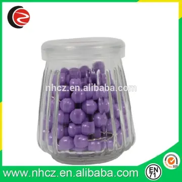 purple round push pin in Glass Bottle