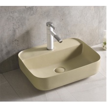 Lavabo rectangular de cerámica negro mate sobre encimera