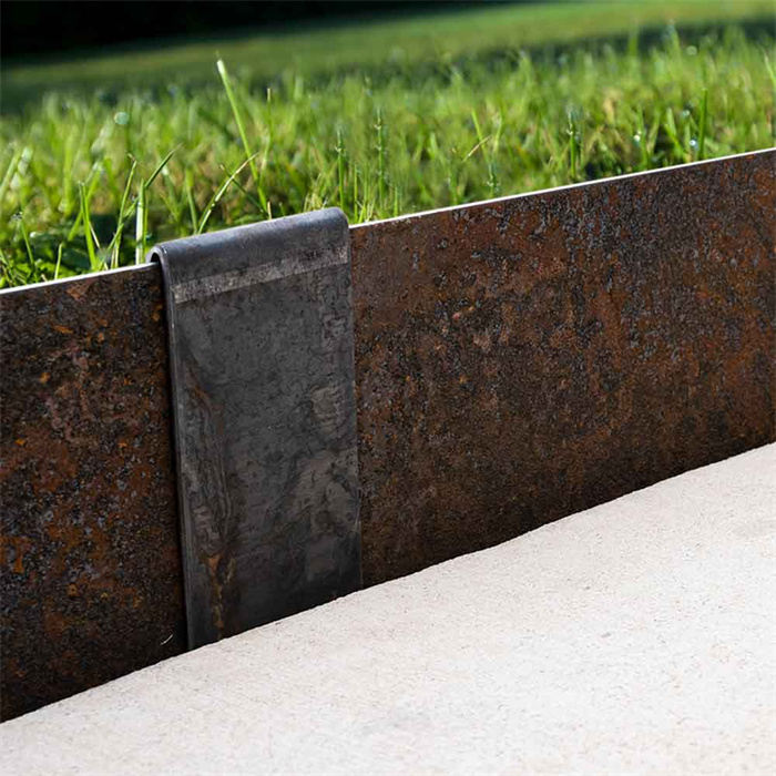 Weathering steel retaining plate