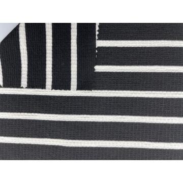 78% Poliéster 21% Rayon 1% Tecido Spandex Jersey