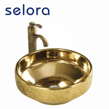 Lavabo de cerámica dorado de lujo pintado en color dorado