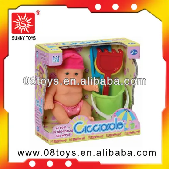 Toy baby with beach tools