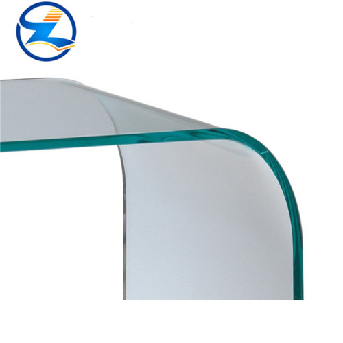 Bent double toughened laminated glass panels