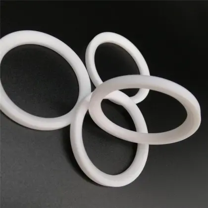 Filled PTFE enhanced low friction ball valve seat