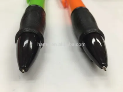 green and orange giant retractable plastic pen