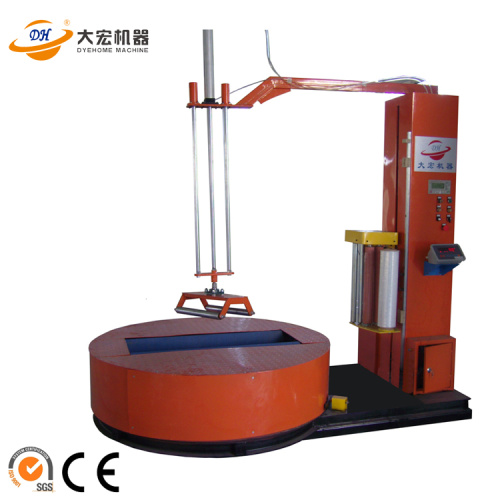 Fabric roll prestretch wrapping machine