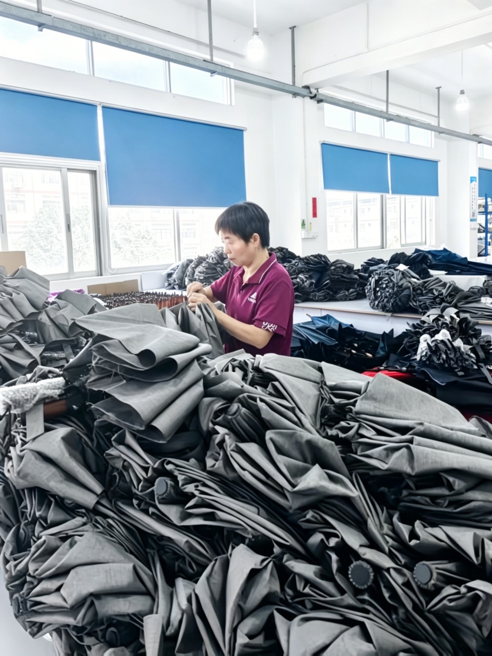 Worker-inspecting-umbrella-quality-control-final-check
