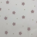 Tessuto in tulle di poliestere con fiori rosa in schiuma e pois dorati