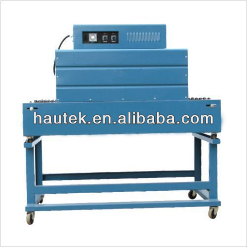 Shrink wrapping machine