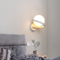 Spiral metal arm wall lamp opal glass shade