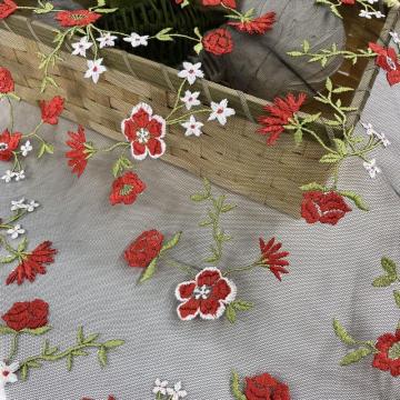 White Poly Yarn Embroidery On Black Mesh Fabric