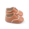 Venda quente de sapatos infantis de couro macio para bebês