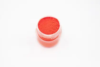Orange-red fluorescent pigments for plastics and inks