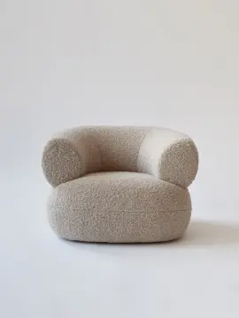 Moving Mountains Puffer chair by boucle fabric