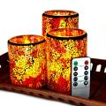 Velas coloridas de pilar de chama da dança em mosaico