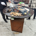 Corten steel fire pit with wooden grill bbq