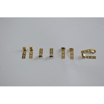 Metal stamping with gilt shrapnel