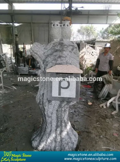 decorative stone mailbox with owls