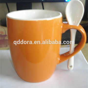 ceramic mug with spoon for coffee and milk
