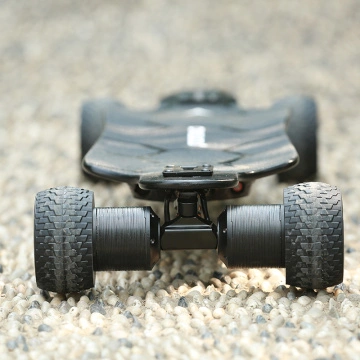 Carving deck electric skateboard with direct drive motor
