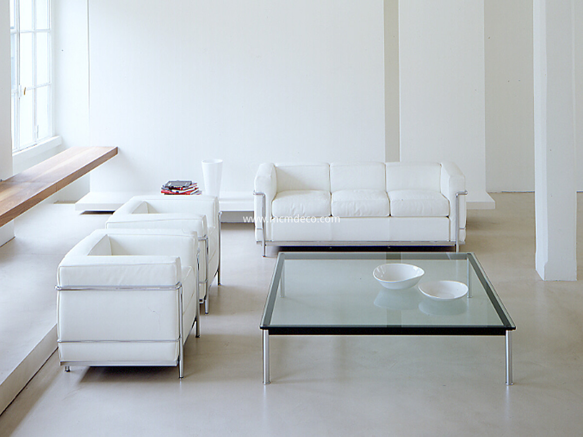 LC2-armchair-in-white-leather-with-Cassina-LC2-3-seater-sofa-and-Cassina-LC10-P-large-coffee-table