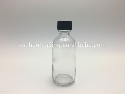 cheap 2oz 60ml clear boston round glass bottle with bakalite cap wholesale