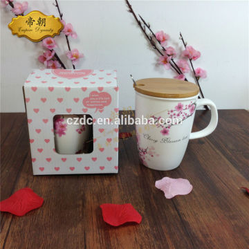 ceramic coffee mug with wooden lids and stainless spoon