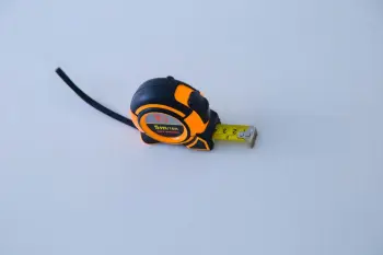 Rubber coated measuring steel tape with grip