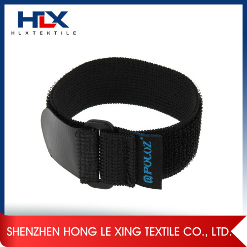 Elastic arm band with hook and loop